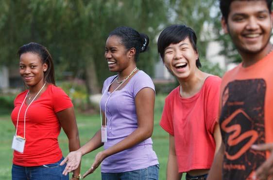 A group of diverse 鶹Ӱ students share a laugh during 4MILE.