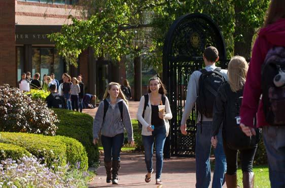 鶹Ӱ students gather and walk outside the Michael E. '67 and Karen L. Fisher Student Center.